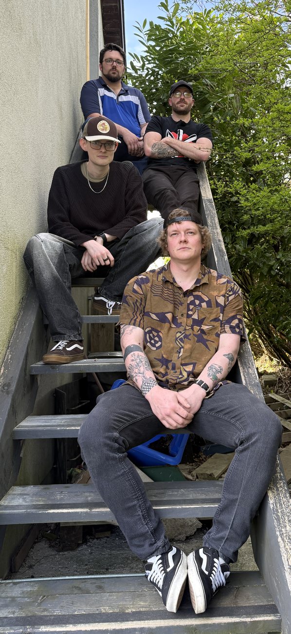 CTRL — the four band members on the studio stairs